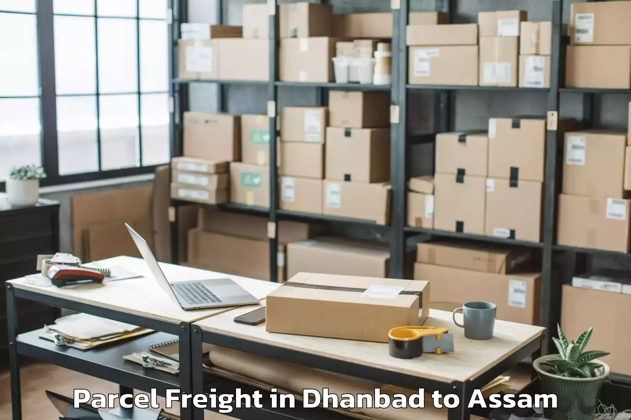 Easy Dhanbad to Laharighat Parcel Freight Booking